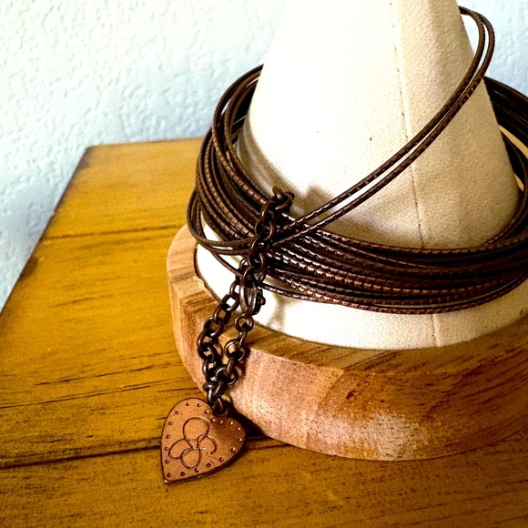 Jessica Simpson Bronze Bangles with Heart Charm - Picture 4 of 11